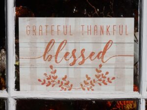 A wooden sign that says, Grateful, Thankful, Blessed